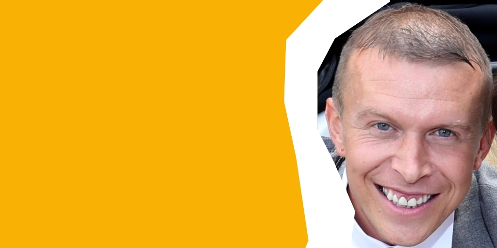 Face on photo of Stuart smiling broadly to camera