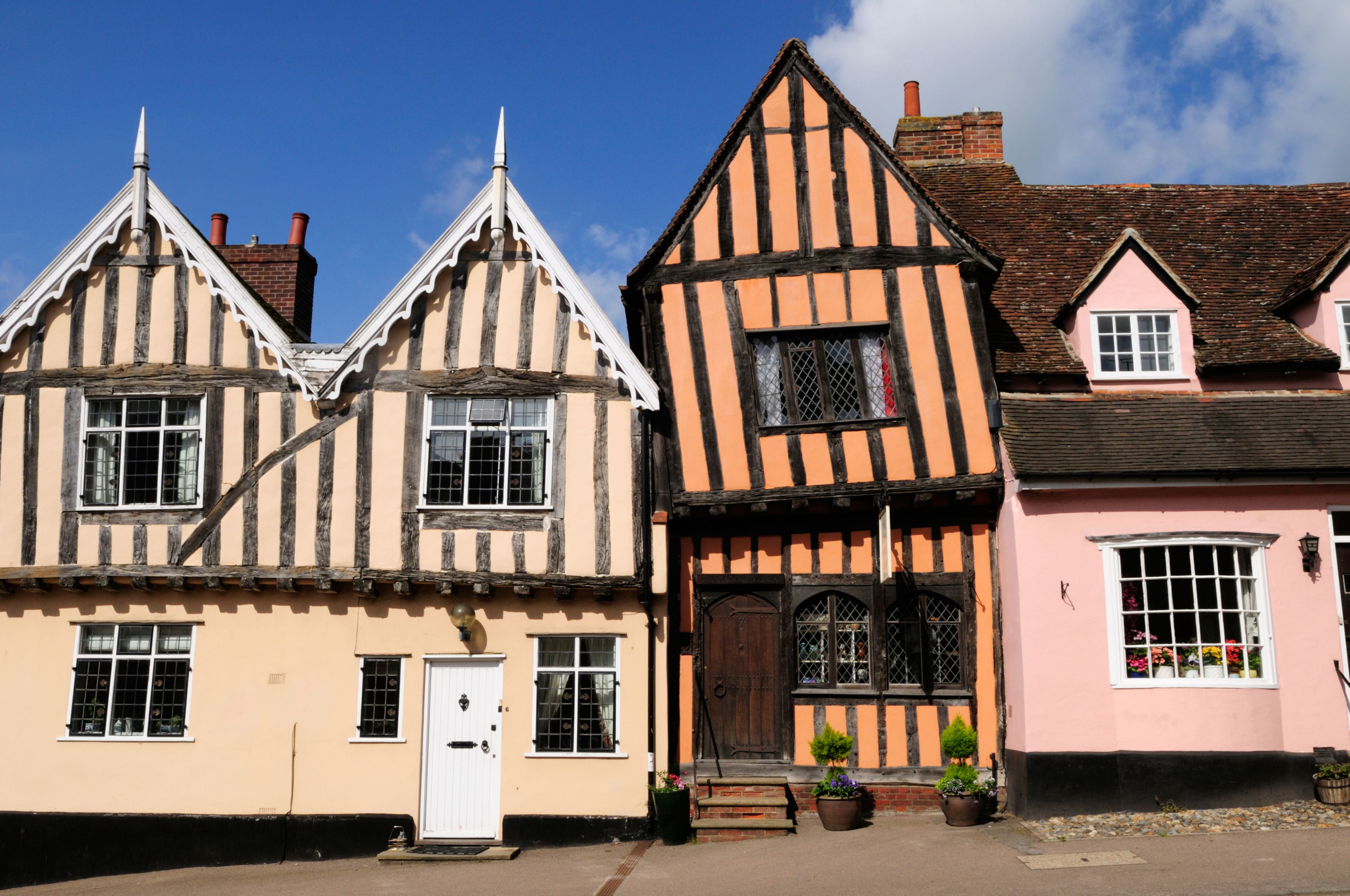 Colourful Tudor houses line a street in Lavenham, Suffolk