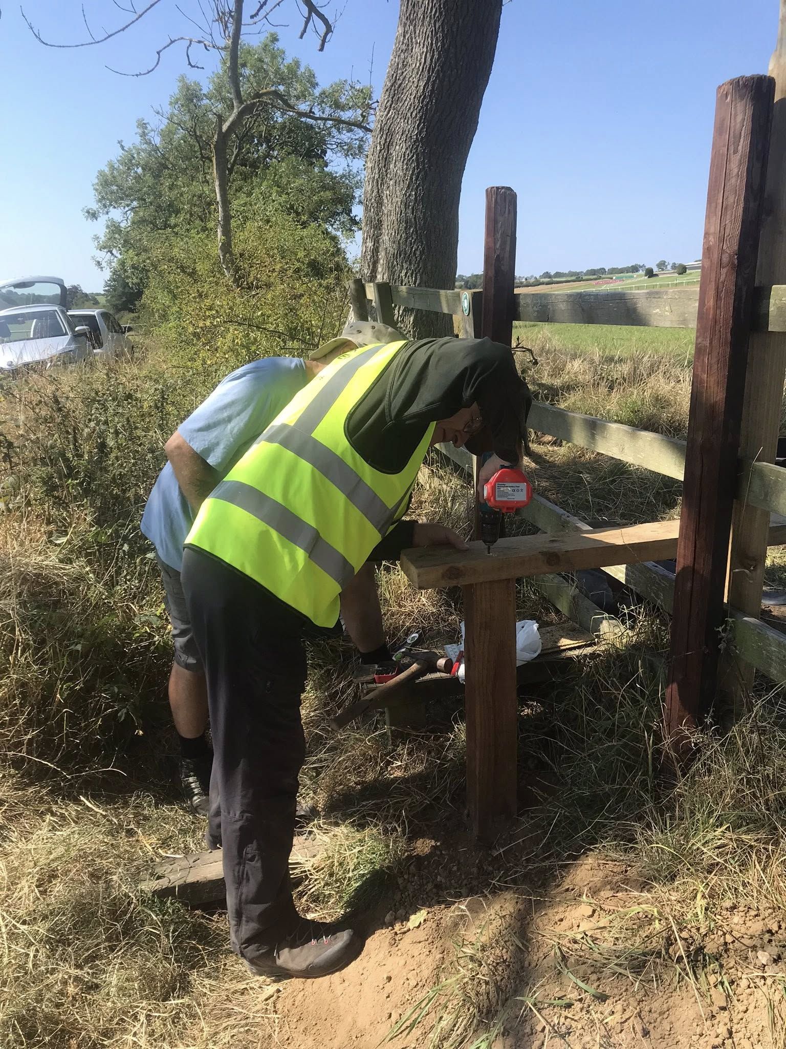 volunteer fixing stile