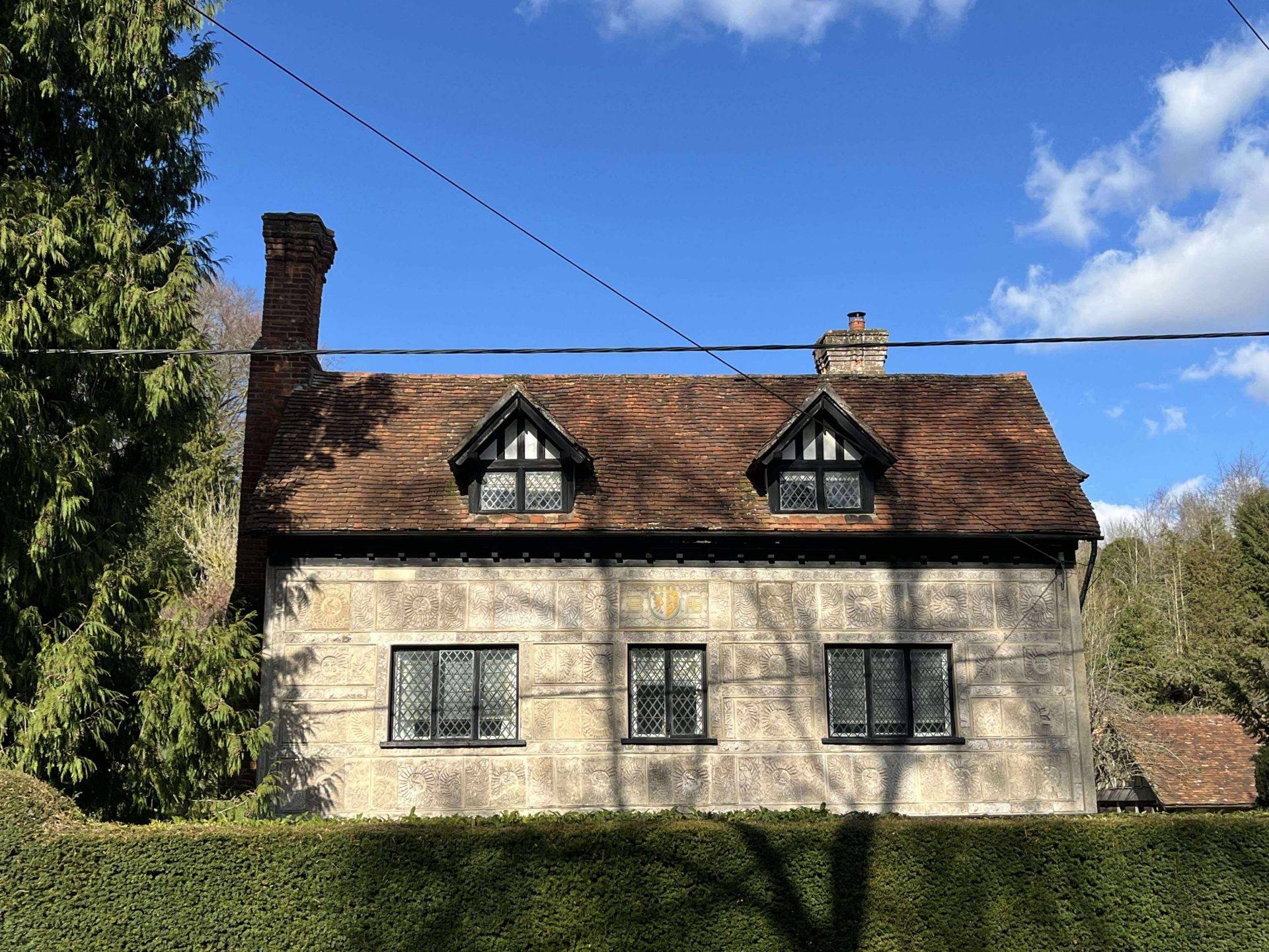 A cottage with ornate stone engraving in Frithsden