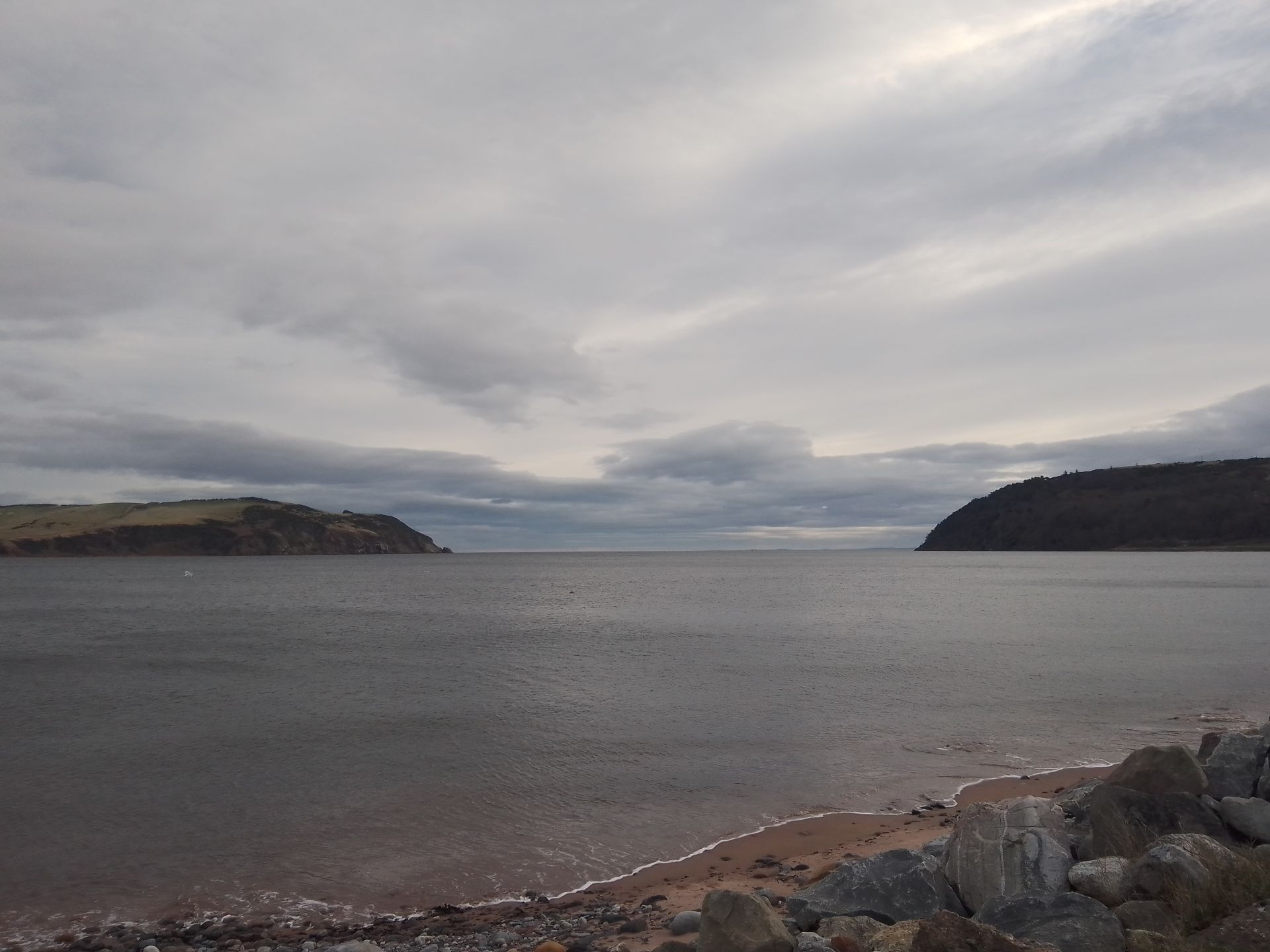 An image of the sutors of Cromarty with a calm sea