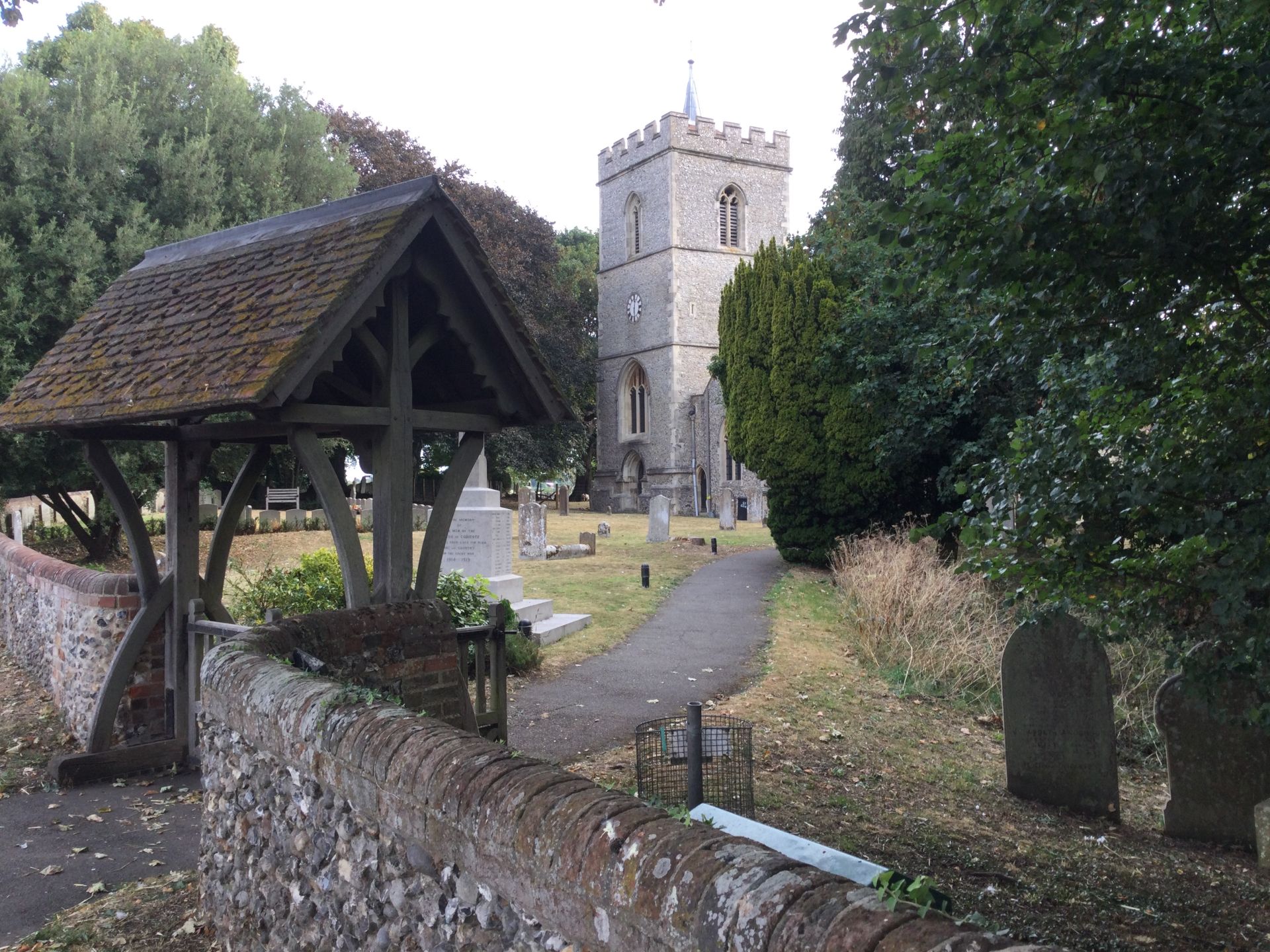 A lych gate, church and graveyard