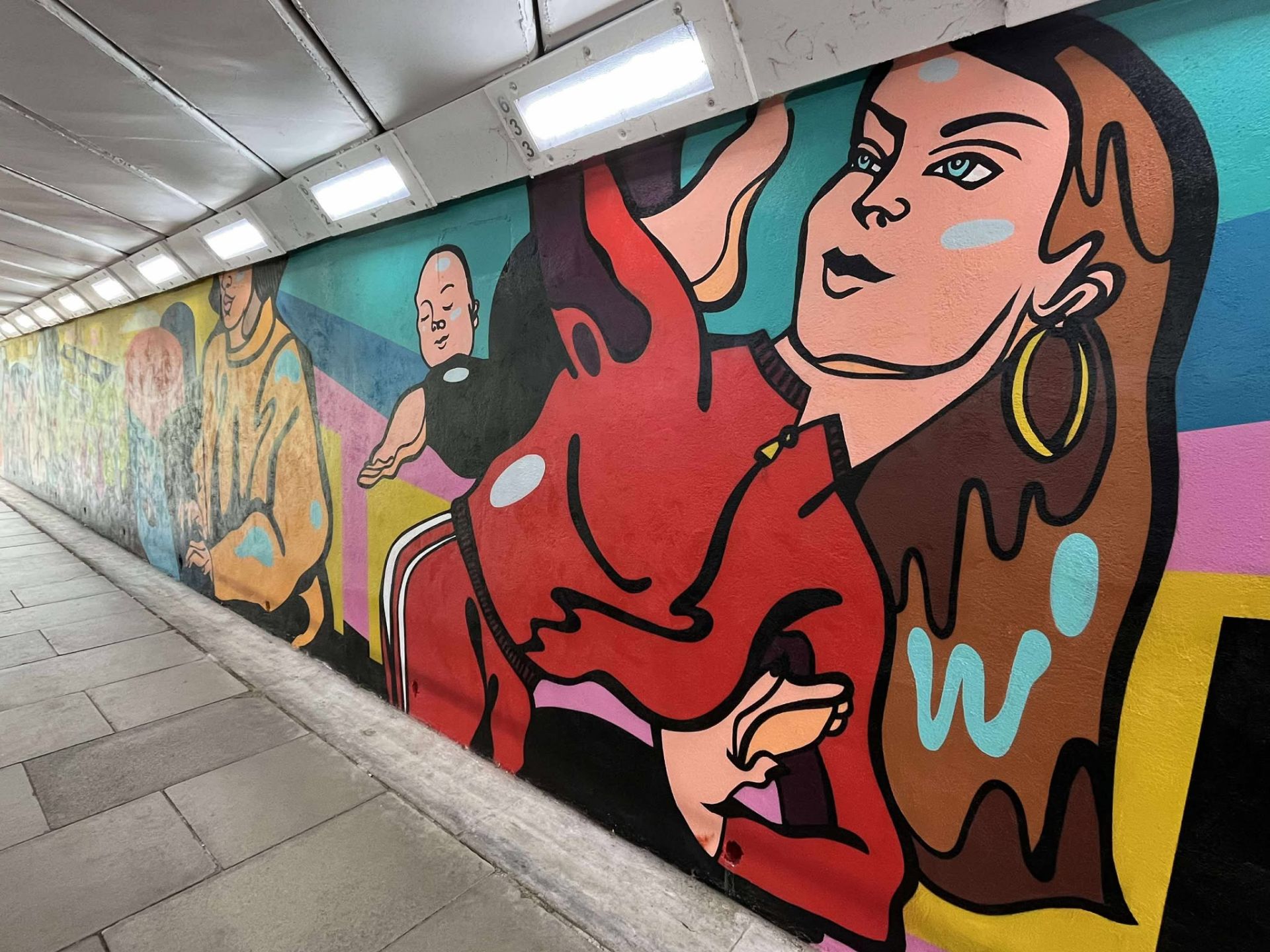 A popart style mural in an underpass