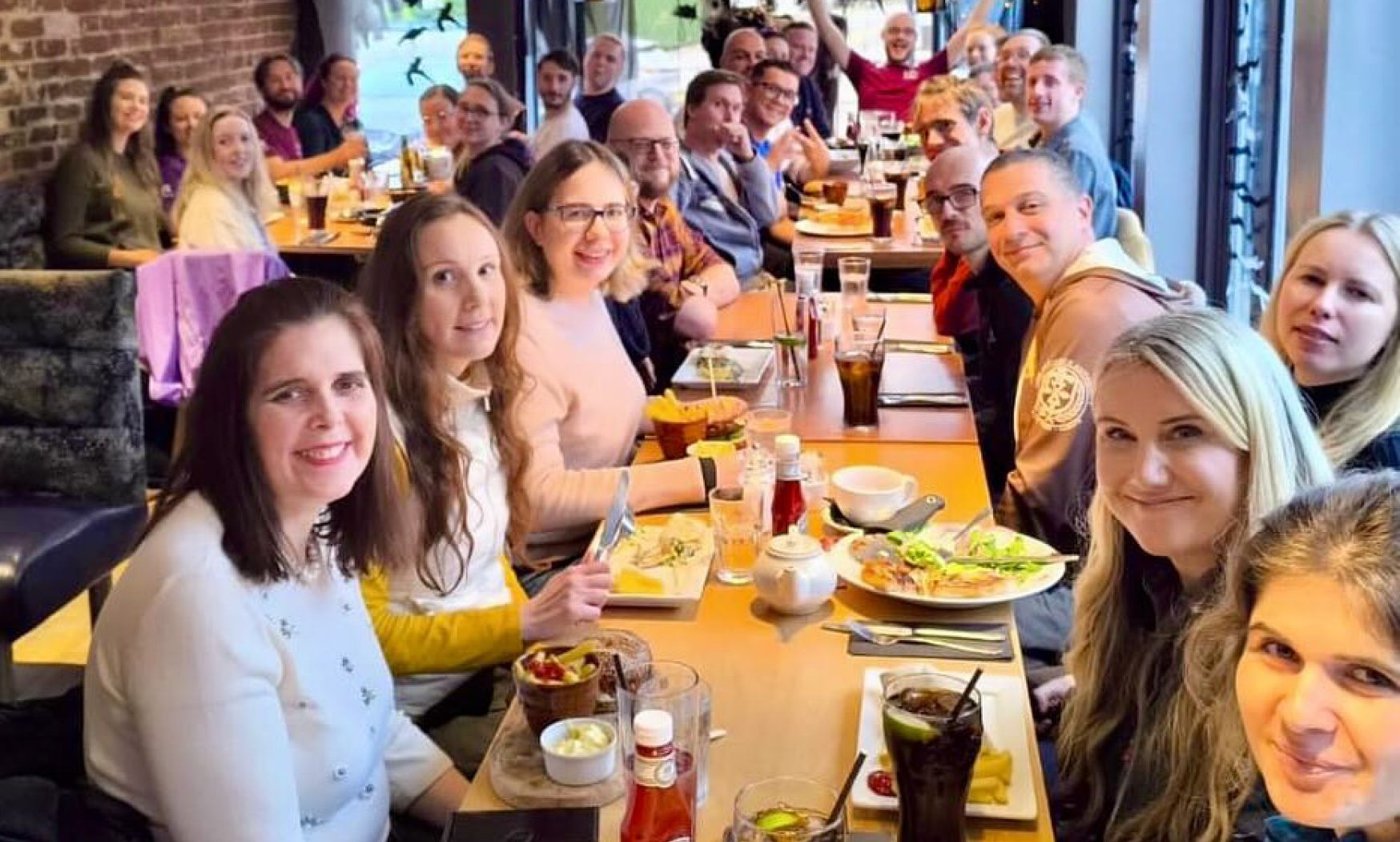 Stag Walkers members sitting at a table with food and drinks