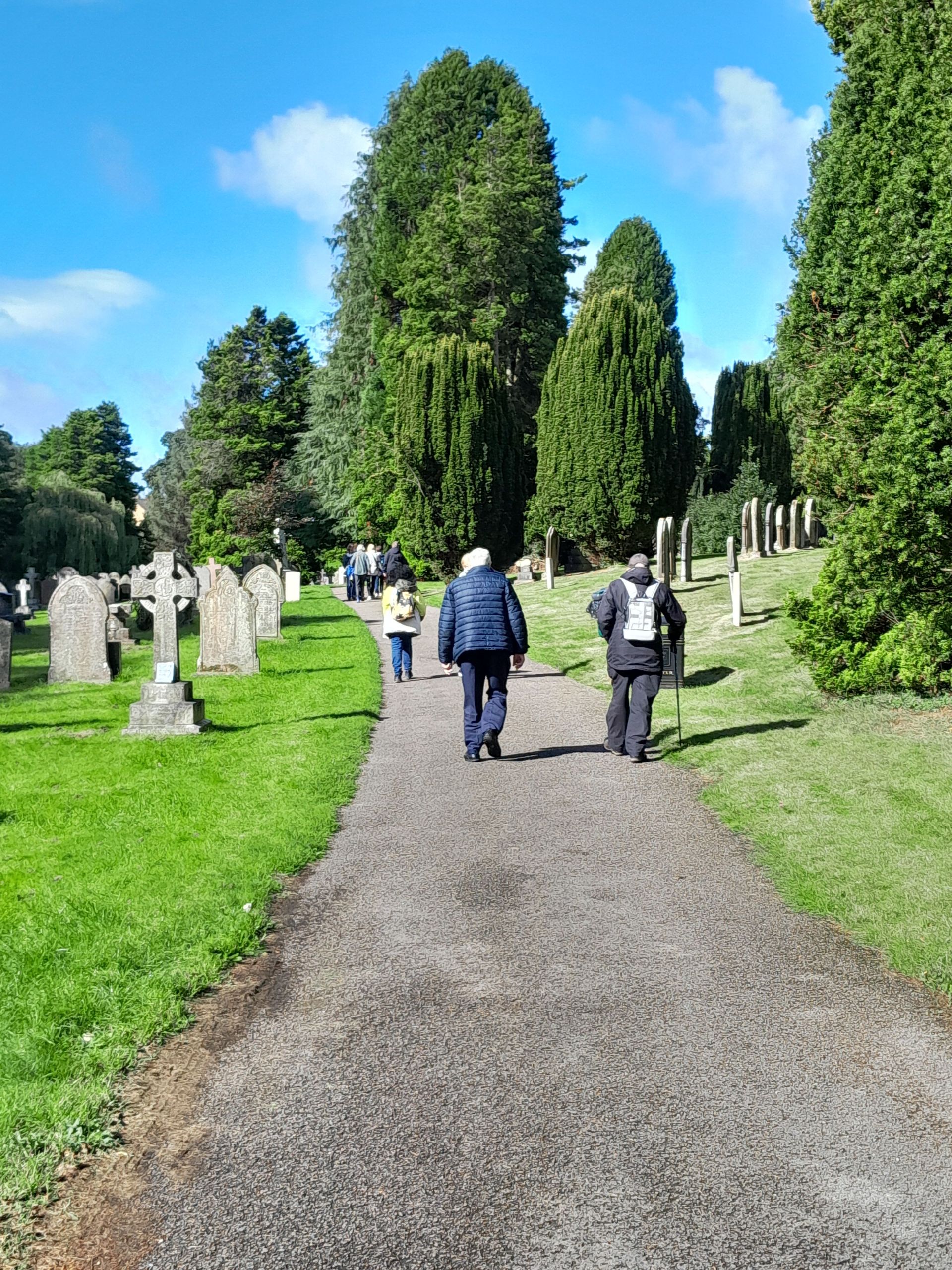 Group walking in cemetery