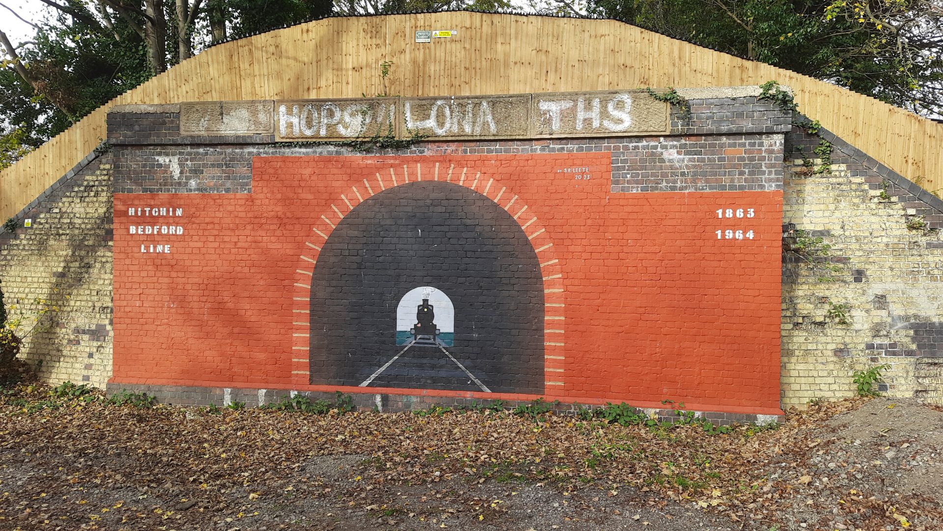 A mural on an old railway embankment
