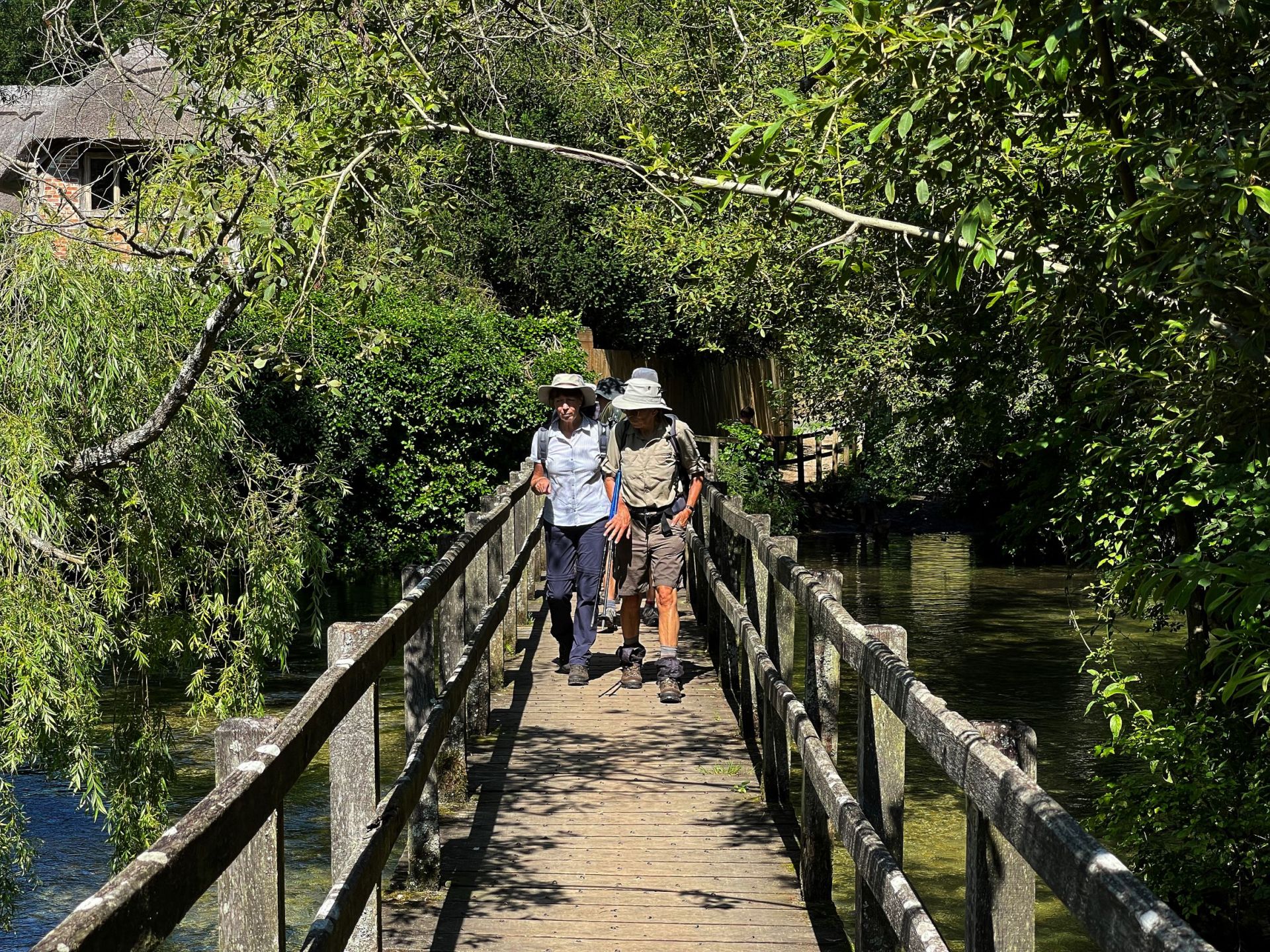 Ramblers walking over footbridge