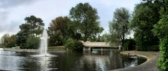 View over pond with fountain and bridge