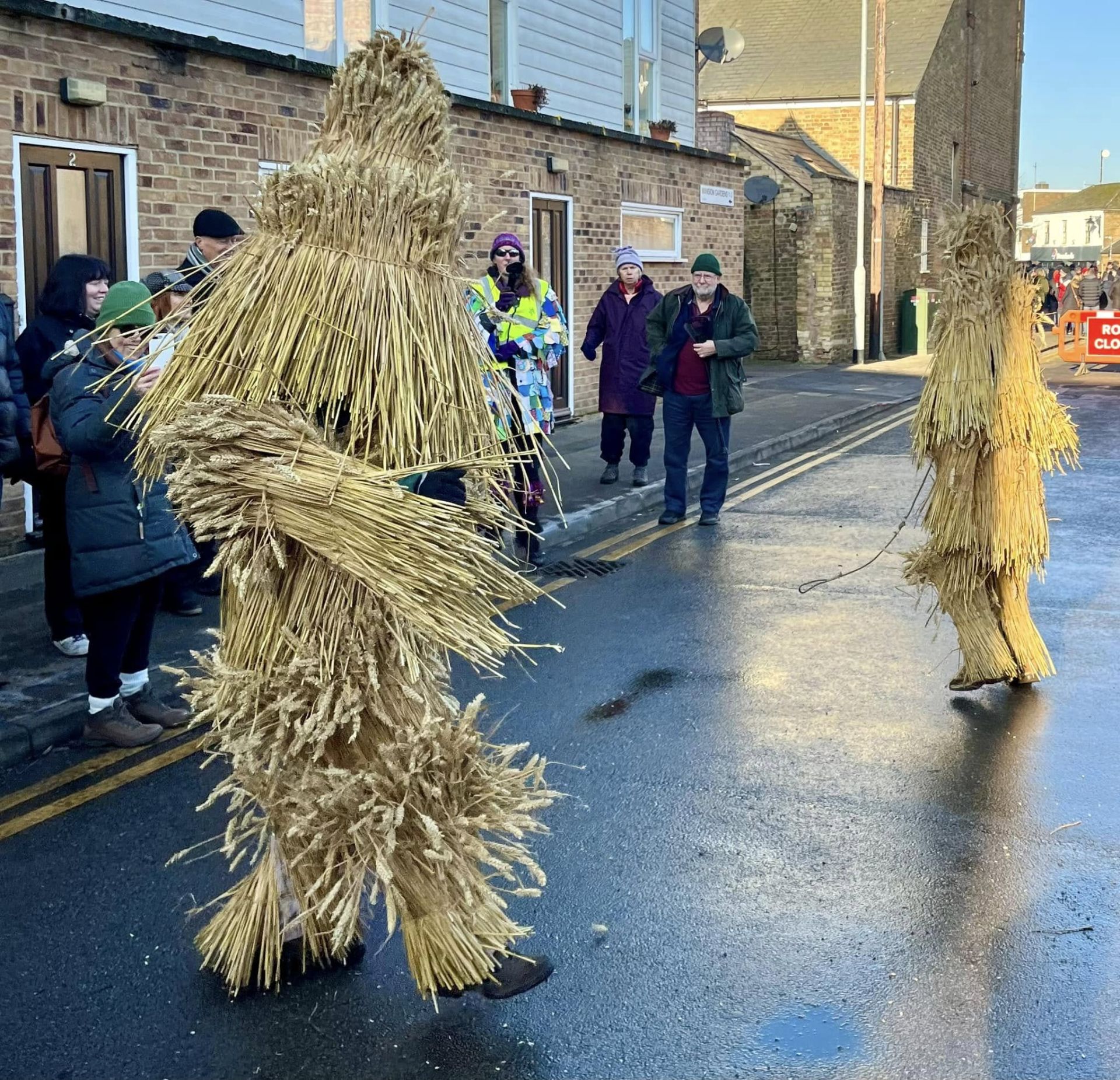 Two people in Straw Bear outfits