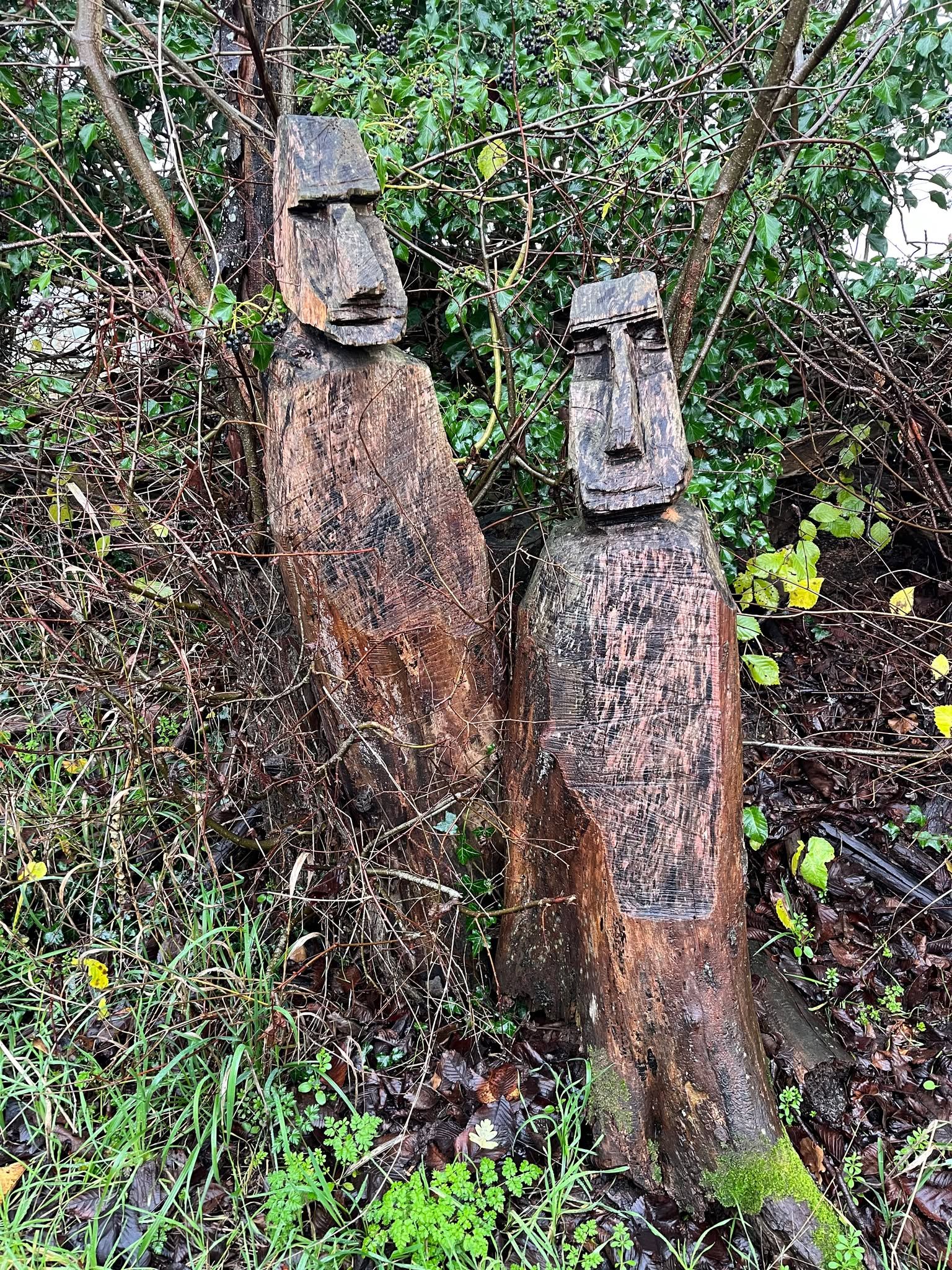 Wooden sculptures in woodland