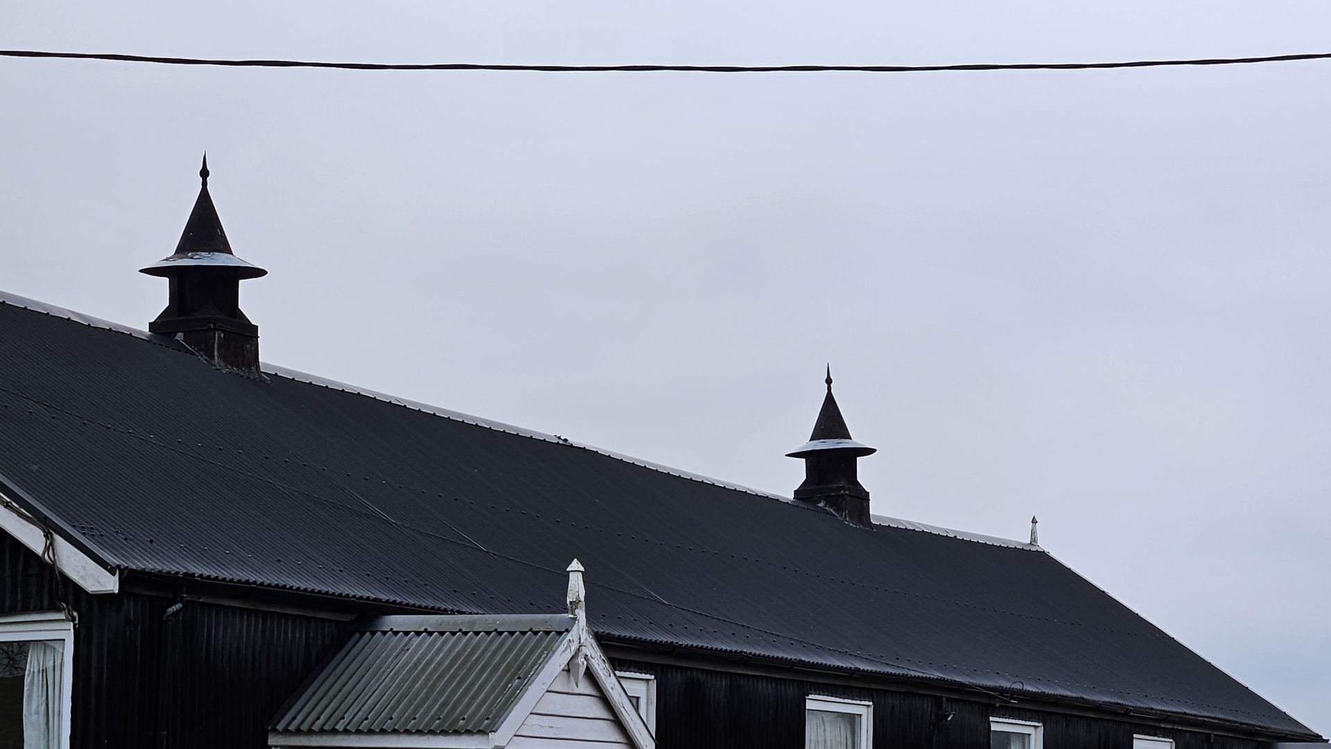 "Wicth's Hats" on roof of village hall