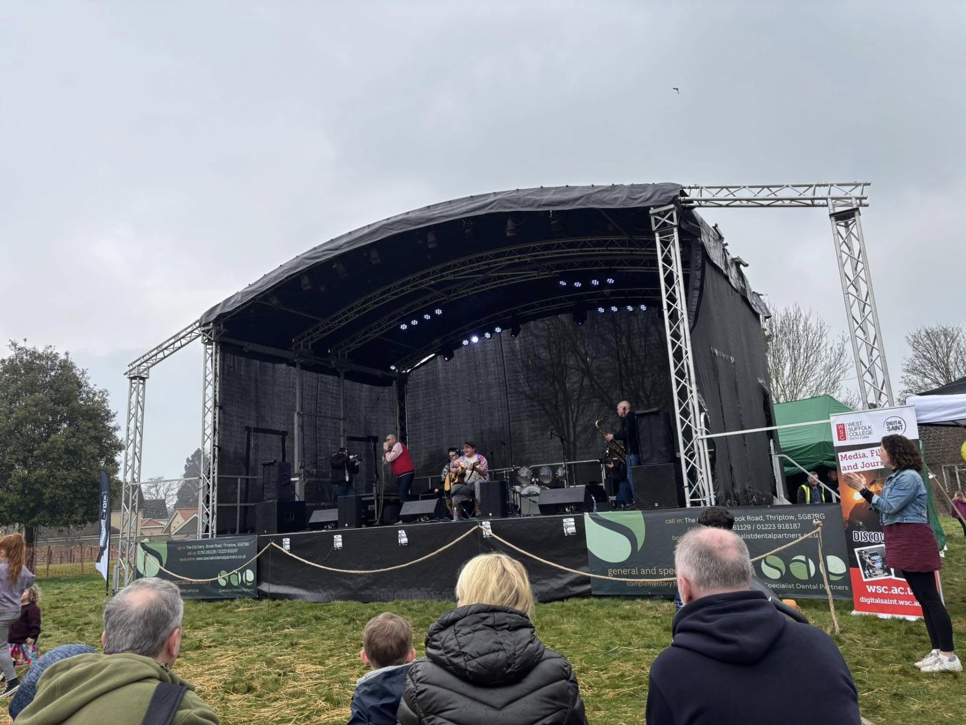 A stage with performers and spectators