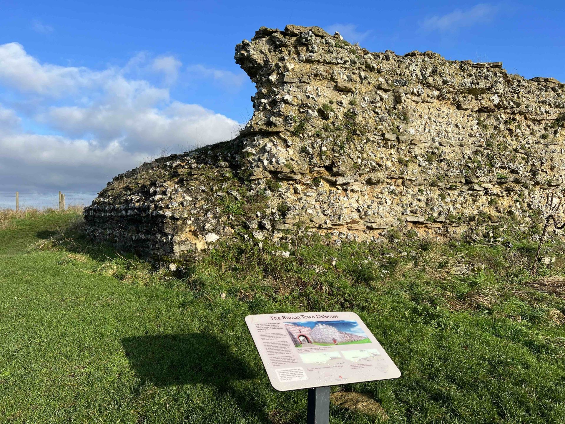 Information board in front of ruins