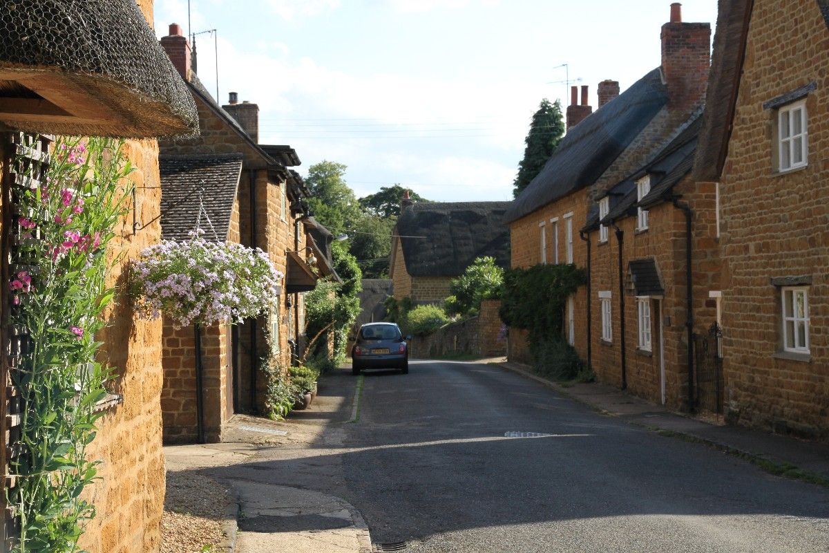 A street with thatched cottages in Wroxton