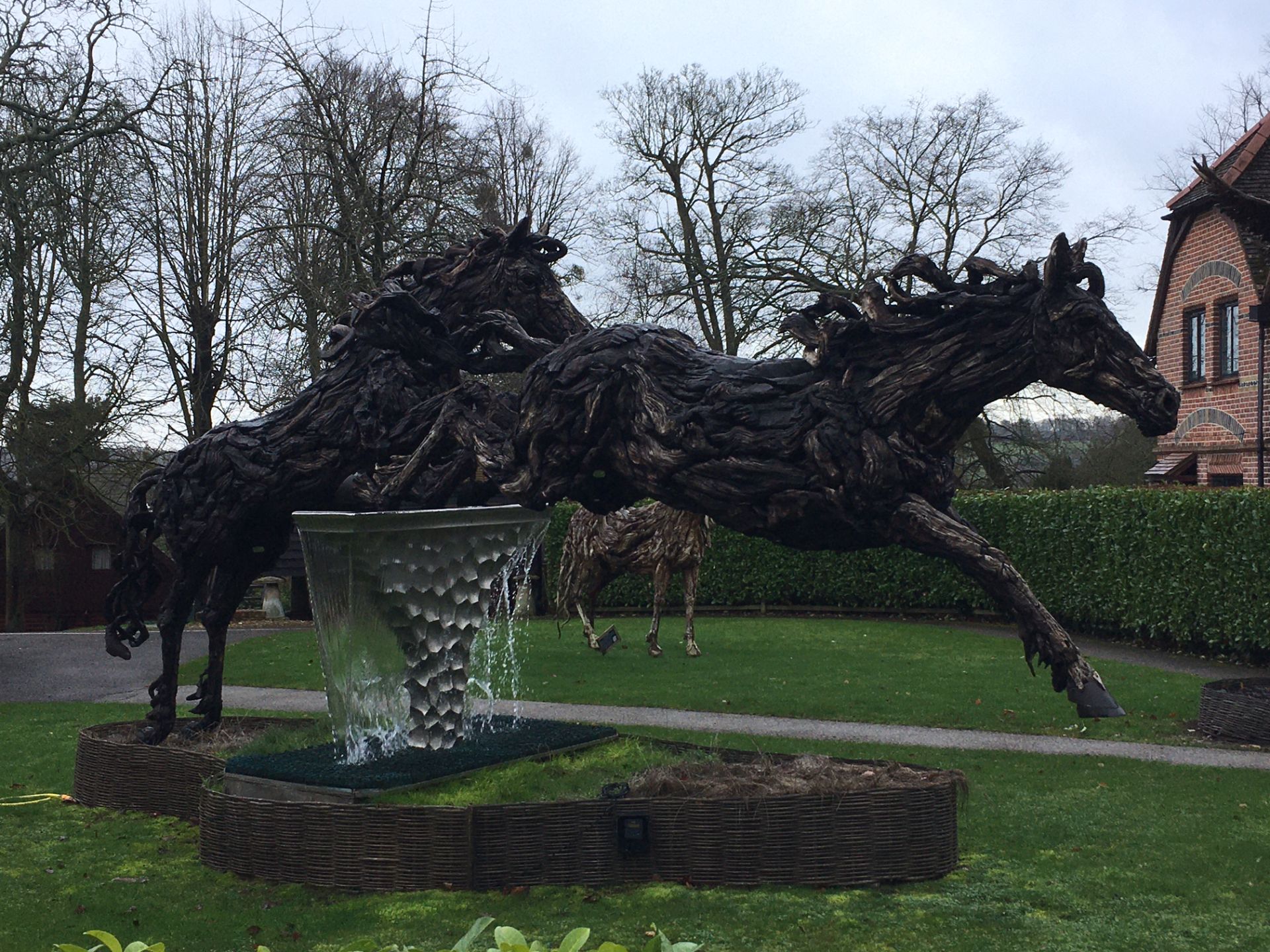 Carved wooden horse statues outside Harleyford Golf Club