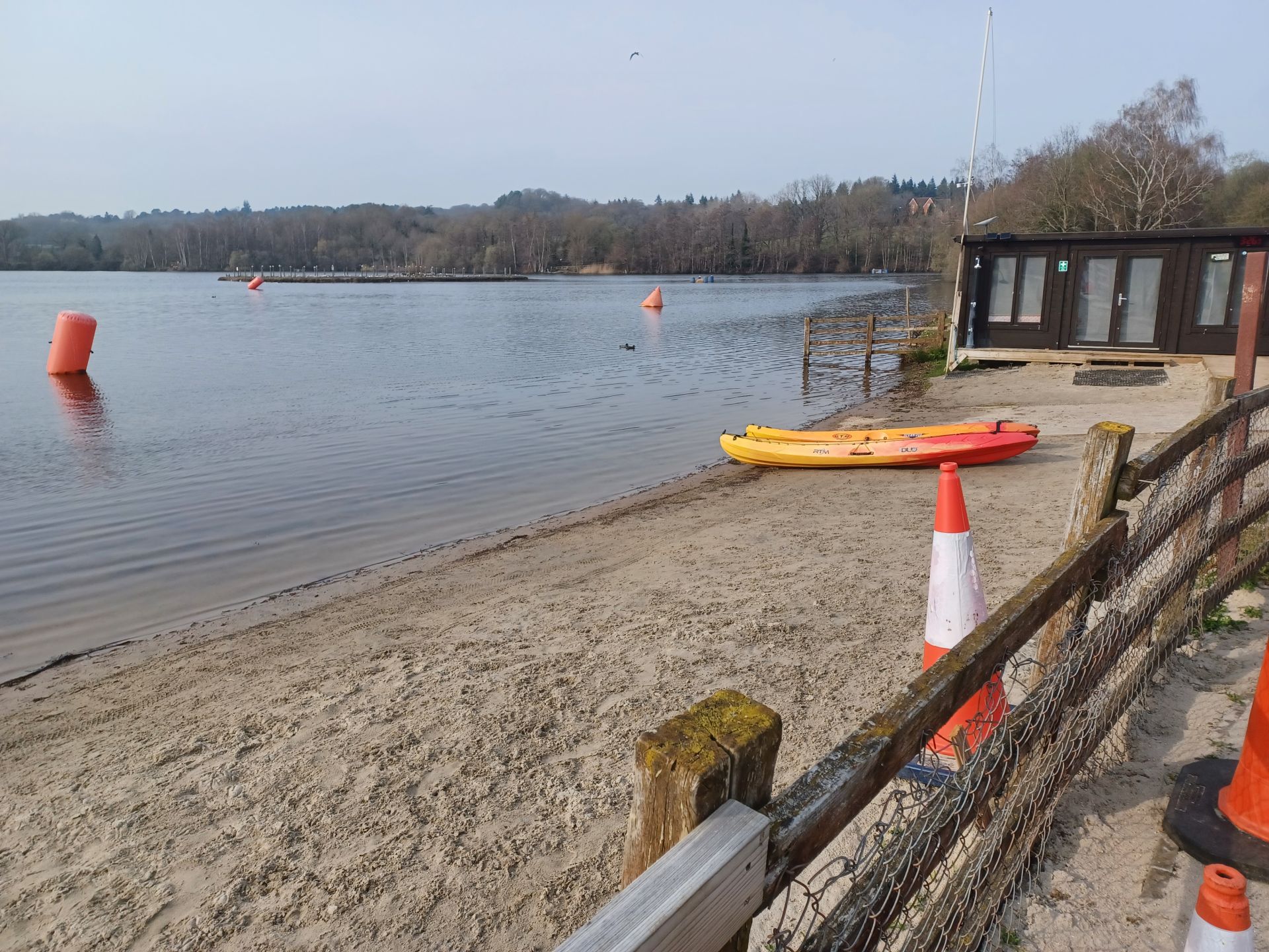 View across watersports lake with small beach