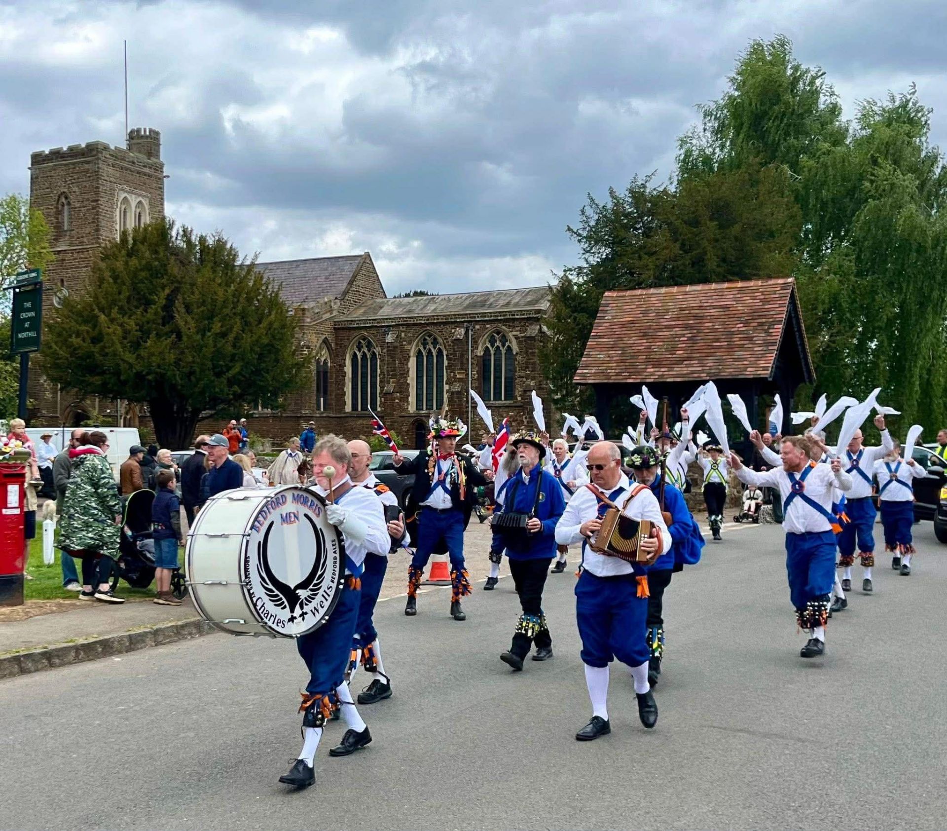 A May Day procession with musicians