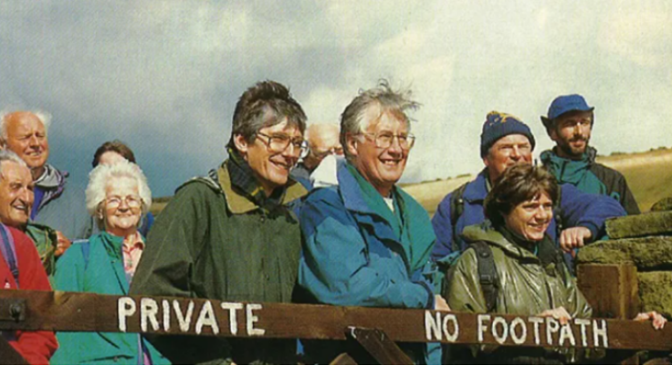 Gordon Prentice and Michael Meacher stand by a "Private No Footpath" sign at a Ramblers event at Boulsworth Hill, 1997
