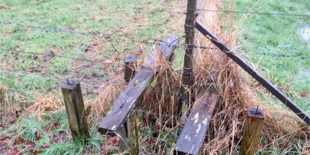 Collapsed stile blocking a path