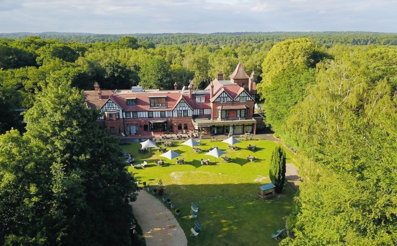 A hotel surrounded by a vast landscape of trees