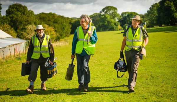 volunteers with tools for path maintenance