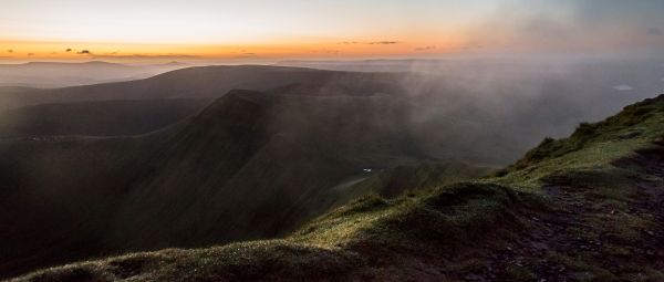 A dramatic view of distant hilltops