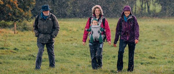 Three Ramblers, and a baby, walking in heavy rain