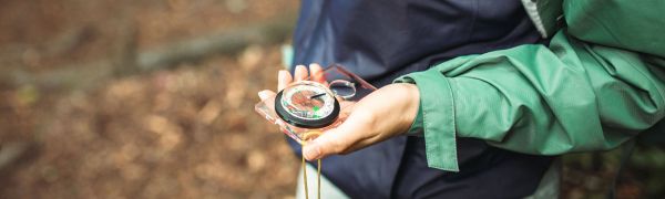 Person holding compass