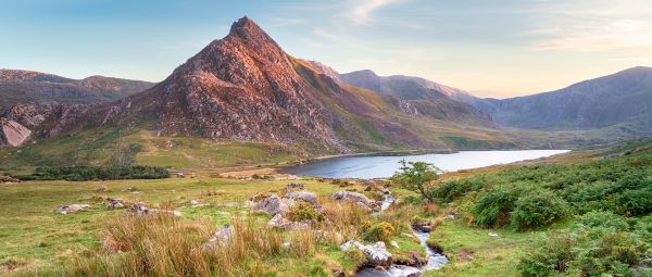 Evening light on Mount Tryfan above Llyn Ogwen in Eryri (Snowdonia) National Park in Wales 