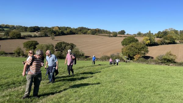 Greenway Ramblers walking up a hill in the sunshine