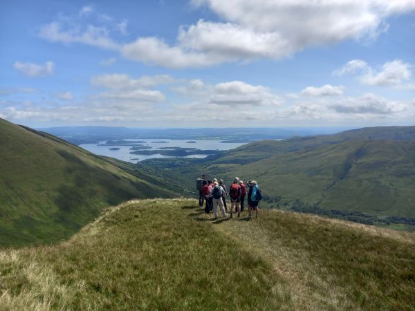 Walkers above a loch