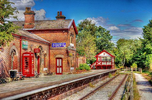 The eastbound platform of the  disused railway station at Hadlow Road, Willaston. The station has been renovated to look like it would have at the time of its closure to passengers in 1956
