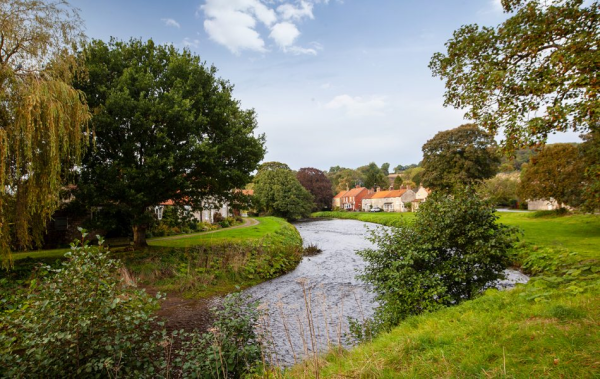 River running through a village green