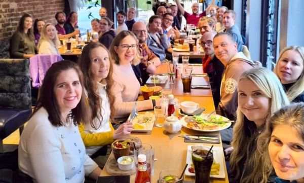 Stag Walkers members sitting at a table with food and drinks