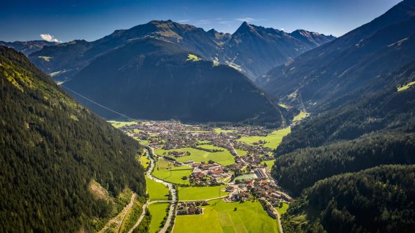 View of a sunny alpine mountain valley