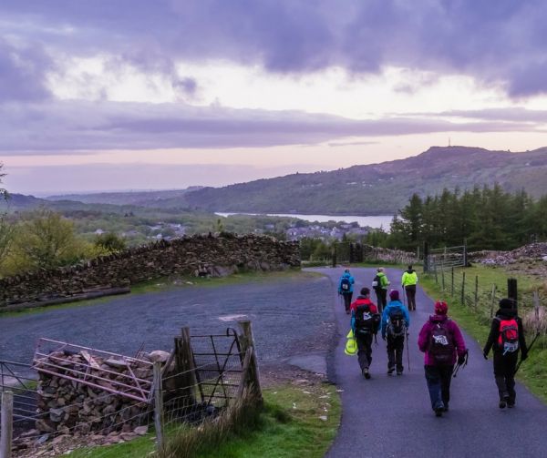 Group of walkers in Snowdonia at dusk