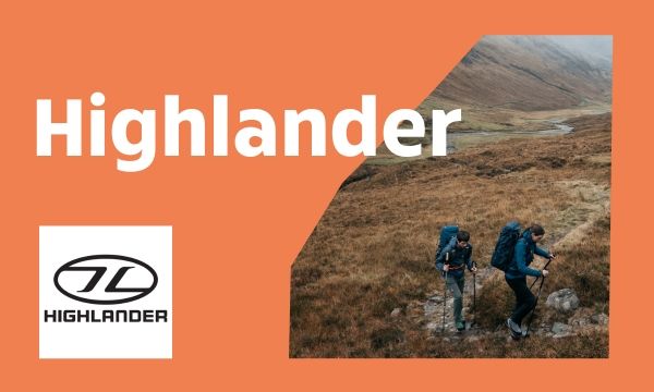 Orange promotional banner with the word “Highlander” in large white letters. On the right, two backpackers hike across a rocky, grassy highland terrain under overcast skies. On the left, the Highlander logo is displayed in black and white.