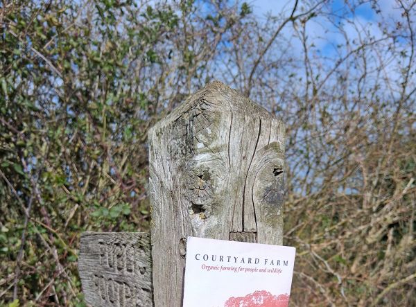 Courtyard farm leaflet by a finger post