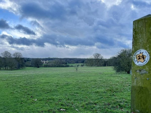 A field and waymarker