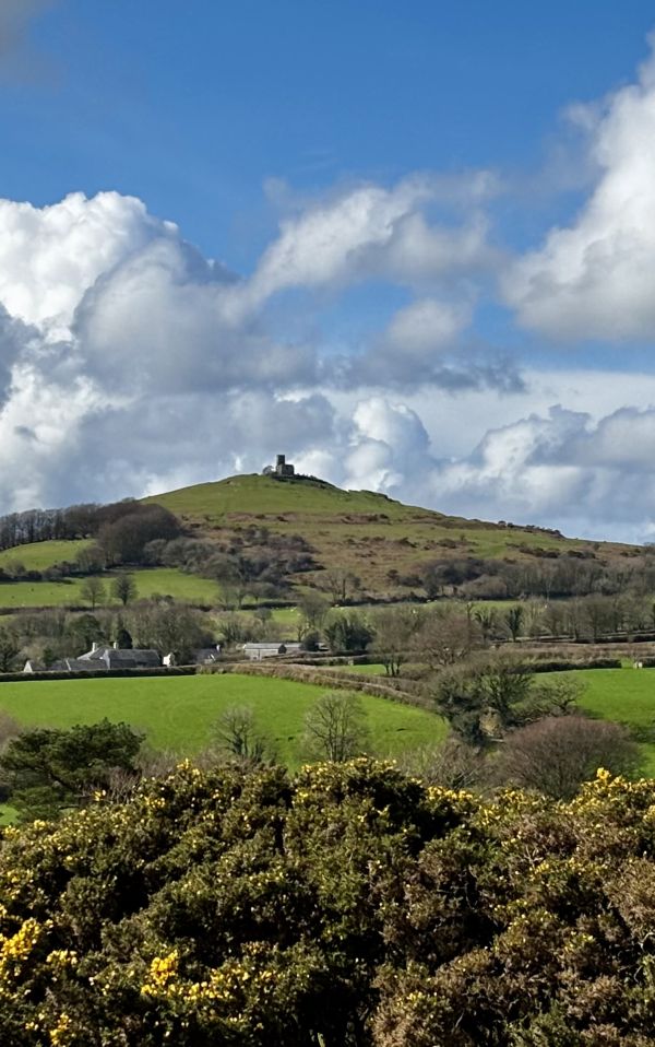 View of Brentor Church at the top of a hill