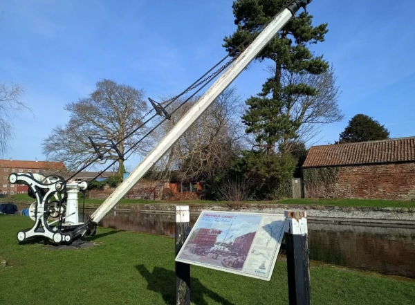 Canal with loading machinery in town