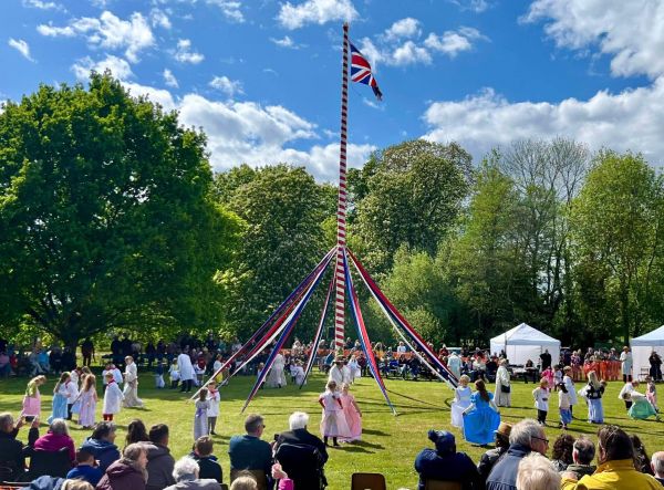 A maypole and dancers
