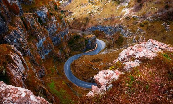 A winding road through a steep rocky gorge