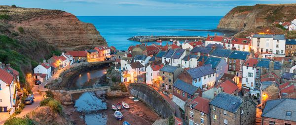 Nightfall over Staithes, a pretty fishing village on the Yorkshire coast, England