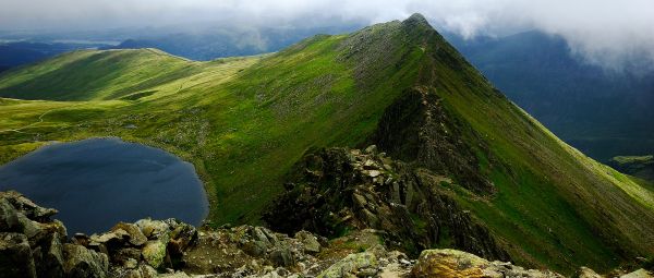 Striding Edge, a narrow, rocky ridge surrounded by sheer drops, stretches into the distance 