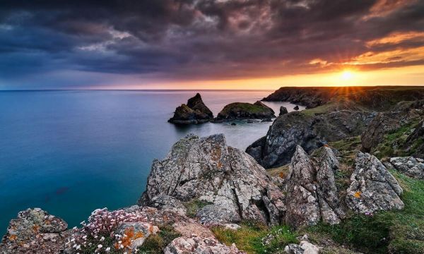 Pointed rocks above a cliff and sea