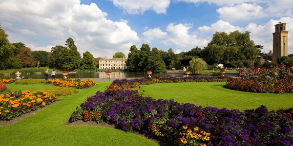 The colourful beds of Kew Botanical Gardens give way to the River Thames