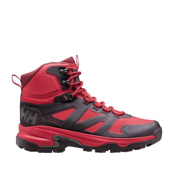 A bright red and black mid‑cut hiking boot featuring mesh and synthetic overlays, secure metal lace eyelets, and a padded ankle collar. The boot has a bold red midsole, rugged tread, and Helly Hansen branding near the heel.