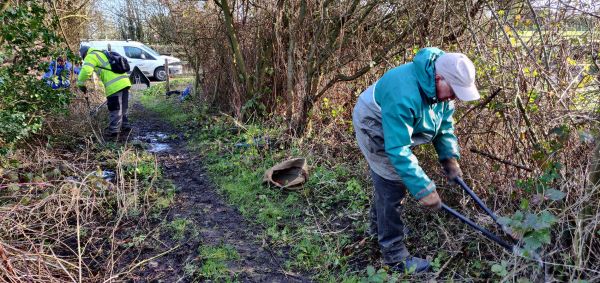 volunteers clearing vegetation form a footpath