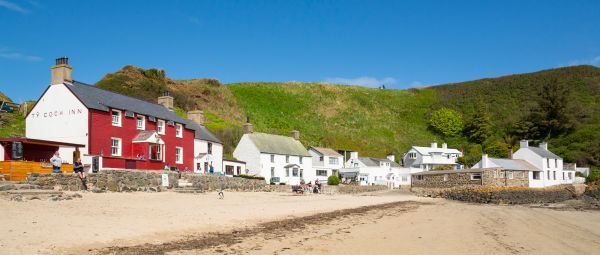 The Ty Coch Inn or 'Red House' is a well known pub in the small coastal village of Porthdinllaen overlooking the Irish sea. 